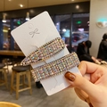 Close-up of sparkling colorful rhinestone hair clip set with rectangle and drop shapes - Style H (2Pcs Aurora Iridescent Diamond Set)
