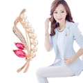Golden alloy brooch with white pearls, red gemstones and crystal leaf design - No. 13-Gold Red Gem Leaf