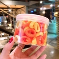 Colorful elastic hair ties in orange and beige tones stored in a clear plastic jar - 100 Pcs Jar / Yellow