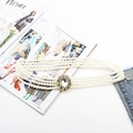 Detailed view of triple-row white pearl elastic belt with a sparkling rhinestone gold buckle - Full Rhinestone Oval Center Buckle