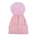 Detail of pink cable knit baby beanie featuring a large fluffy faux fur pom-pom topper - Pink