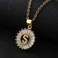 Macro shot of letter S medallion pendant with baguette-cut cubic zirconia in gold - Gold Letter S