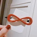 Elegant orange infinity bow hair clip made of glossy acrylic resin with metal base - Rose Red