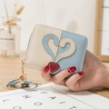 Women's mini bifold wallet in beige and blue leather featuring a heart patch and blue tassel - Blue