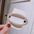 Minimalist oval acrylic spring hair clip in milk tea beige on a white brand card - Puffy Oval / Off-white