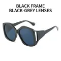 Fashion sunglasses with oversized black geometric frames and grey lenses with cut-out details - Glossy Black Frame Grey Lens