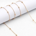 Polierte 18K vergoldete Brillenlkette mit filigranen Gliedern und runden Perlenverzierung - Goldperle Goldkette