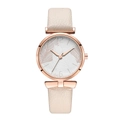 Detail of rose gold quartz watch featuring elegant white leaf texture on the dial - Beige