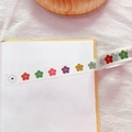 Close-up of washi tape roll featuring colorful floral patterns on a notebook - 6# Flower