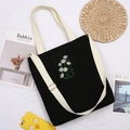 Black corduroy tote bag with daisy embroidery and adjustable cream shoulder straps - Black