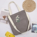 Grey corduroy tote bag featuring white daisy embroidery and adjustable shoulder strap - Gray