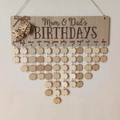 Detail of wooden family birthday reminder board with hanging tags and heart accents - Mum & Dad's BIRTHDAYS (JM00893)