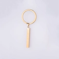 Detailed view of a golden minimalist stainless steel bar pendant on a circular keychain - 18K Gold (MP098)