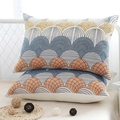 Pair of pure cotton gauze pillowcases with colorful wave patterns on a white bed frame - Blue Scallops (Pair)
