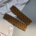 Brown Tabi socks with black number matrix print in cotton knit fabric mid-calf style - Mustard Yellow