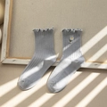 Calcetines de algodón azul grisáceo con puños con volantes y bordado de margarita - Talla única / Azul
