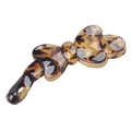 Detail of tortoise shell resin bow-shaped hair clip with smooth glossy texture - Light Coffee Spotted