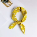 Yellow silk narrow scarf with white feather print tied in a decorative elegant knot - Leaf Pattern Yellow Base / One Size