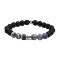 Detail of matte black beads and Capricorn zodiac metal charm on the stretch bracelet - Capricorn