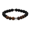 Macro view of Libra zodiac 8mm tiger eye and matte black beads bracelet with silver charm - Libra