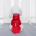 Detailed view of red pet raincoat with honeycomb texture and safety reflective strip - M / Red