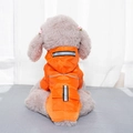 Detail of orange pet raincoat with honeycomb texture and high-visibility reflective strip - M / Orange