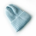 Minimalist light blue knitted beanie for kids featuring a soft folded cuff and warm texture - Sky Blue