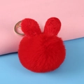 Red plush rabbit pom-pom keychain with gold lobster clasp on colorful background - Rabbit Ear / Red