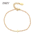 Detail of gold-plated stainless steel cross bracelet with small pink enamel beads - Pink