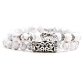 Close-up of white turquoise beaded bracelet featuring a silver elephant pendant and vintage tube - Elephant Set