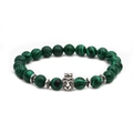 Detail of beaded bracelet featuring green malachite beads and silver lion head with crown - Crown Lion Head Accessory