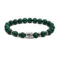 Detail of beaded bracelet with green malachite stones and silver Buddha head charm - Buddha Head Accessory