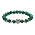 Malachite beaded bracelet with silver owl charm and hollow metal spacer beads on white background - Owl Accessory