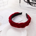 Elegant deep red braided velvet headband with wide twist design on a white stylist tray - Burgundy