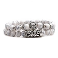 Close-up of white turquoise beaded bracelets with vintage silver lion head and totem charms - Lion Head Set