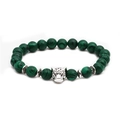 Macro detail of silver leopard head charm on a natural green malachite beaded bracelet - Leopard Head Accessory