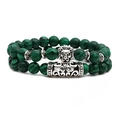 Malachite bead bracelet set with silver lion head and filigree tube charms on white background - Lion Head Style
