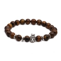 Macro view of tiger eye bead bracelet featuring a silver lion head charm with crown - Crown Animal