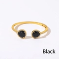 Bracciale rigido aperto dorato con cristallo nero e dettagli in zirconi scintillanti - Oro + Nero
