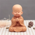 Cute little monk figurine in orange robe with hands in prayer for desktop decor - 1034-1 Sitting Praying