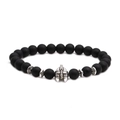 Detailed macro of matte black beads bracelet featuring a silver Spartan helmet charm - Helmet