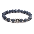 Detail of beaded bracelet set with dark blue stone beads and silver owl charm accent - Owl