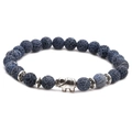 Detail of blue net stone beaded bracelet featuring a silver elephant charm and spacer beads - Elephant