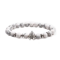Detailed close-up of a white marble beaded bracelet with a silver Spartan helmet charm - Helmet