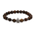 Detailed macro of a brown tiger eye beaded bracelet featuring a silver Spartan helmet charm - Helmet