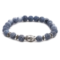Beaded bracelet set with blue weathered stones and a silver Buddha head charm on white background - Lava Stone Buddha Head Long