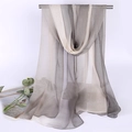 Detail view of lightweight gray and beige gradient chiffon scarf hanging on a stand - Grey Beige Gradient
