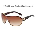 Gafas de sol con montura dorada, lentes degradadas en té y detalle de camelia negra - Marco Dorado Lente Té Degradado (C0.2)