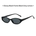 Occhiali da sole ovali cat-eye con montatura nera lucida e lenti grigio scuro - Montatura Nero Lucido Lente Grigia