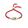 Rotes geflochtenes Armband mit goldenem Hamsa-Hand-Anhänger und blauem Zirkonia - Rot/Gold/Blau